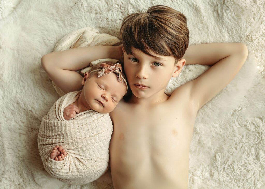customized newborn photo session

brother and newborn baby