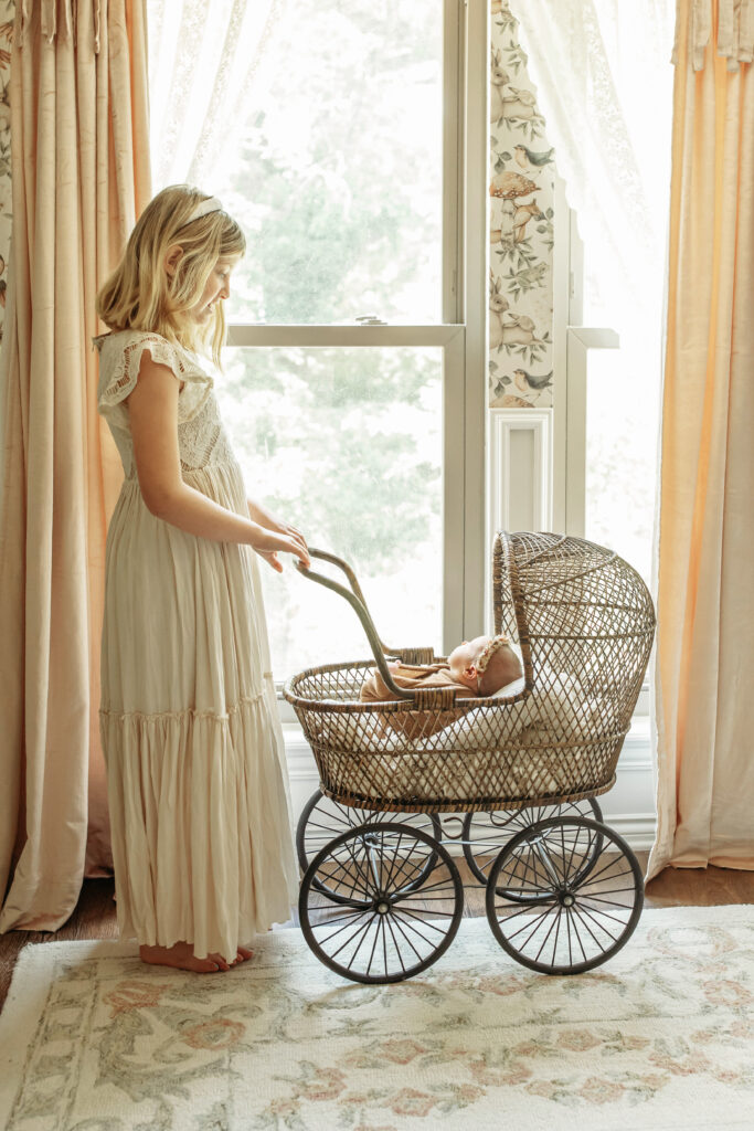 customized newborn photo session

sister and newborn baby with vintage stroller