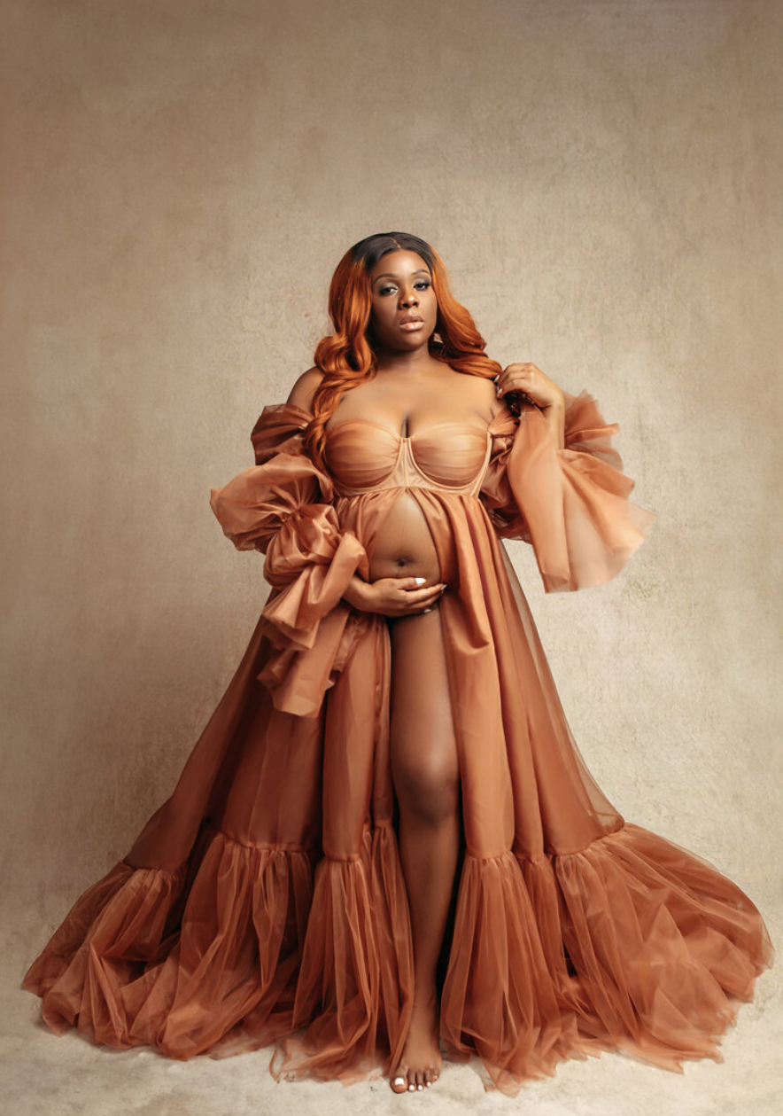 golden orange flowy gown with mother posing in maternity photoshoot